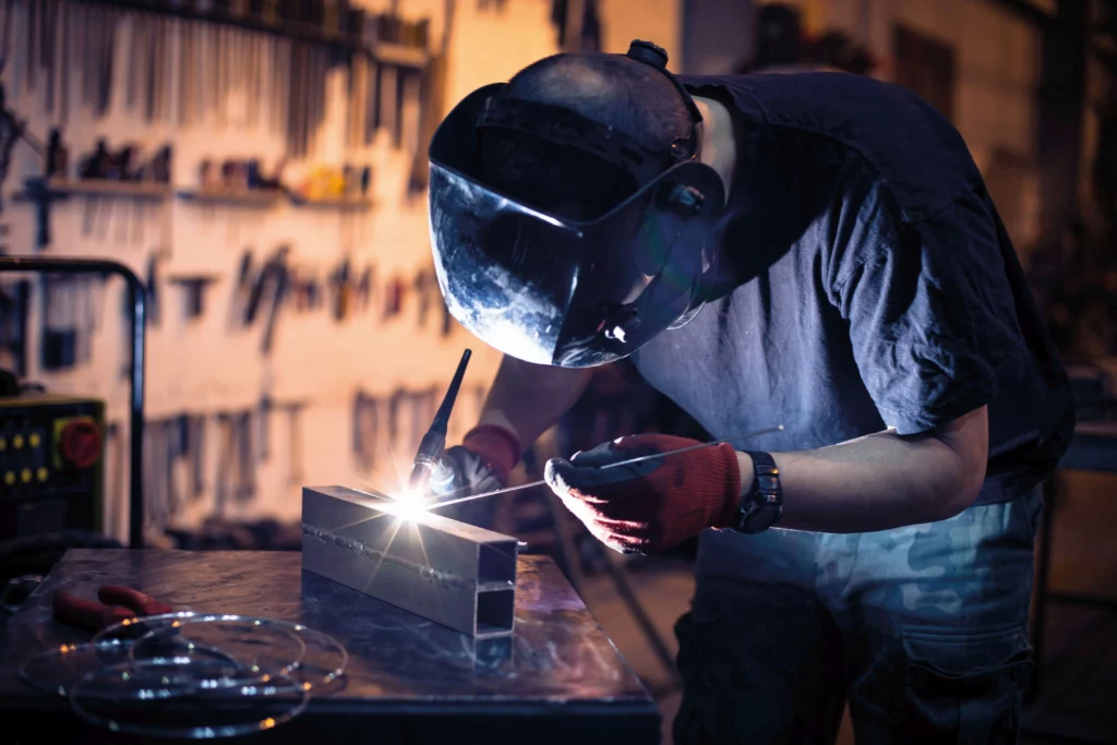 Welder using ER70S-2 TIG Welding Rod on mild steel